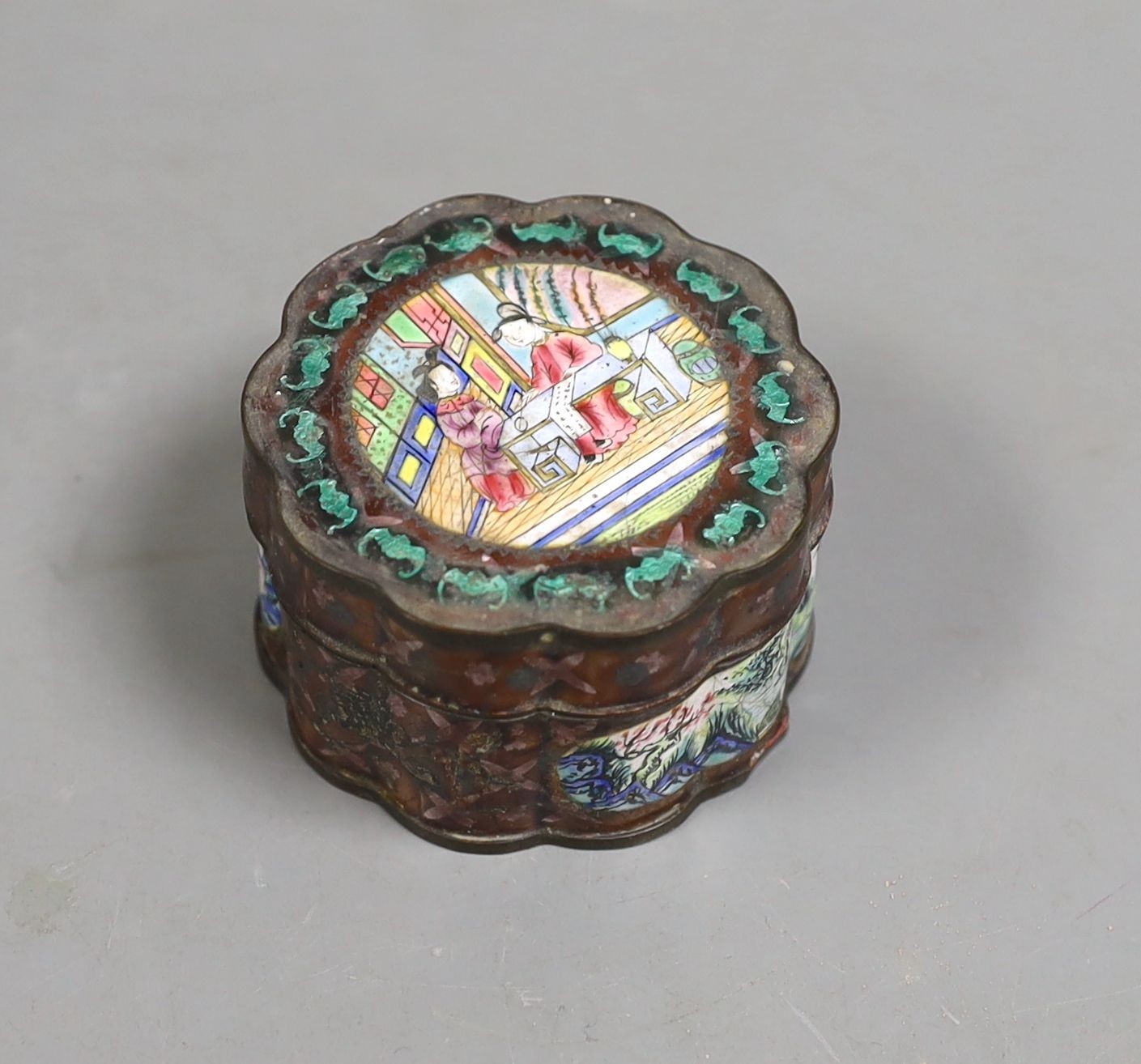 A 19th century Chinese Canton enamel box and cover, 5.5 cms diameter.